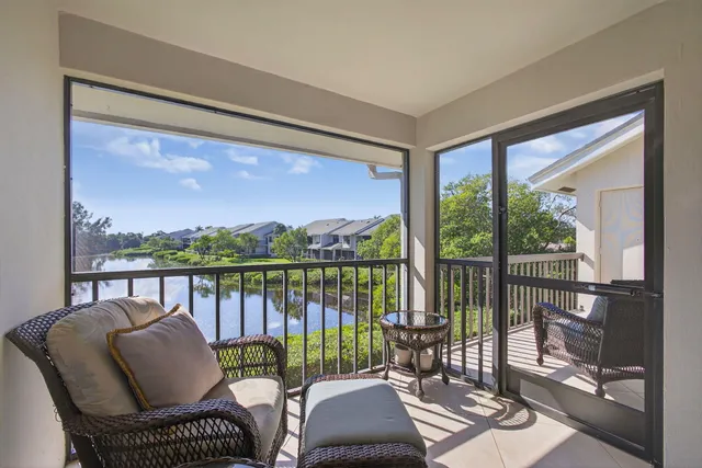 a view of a balcony with furniture