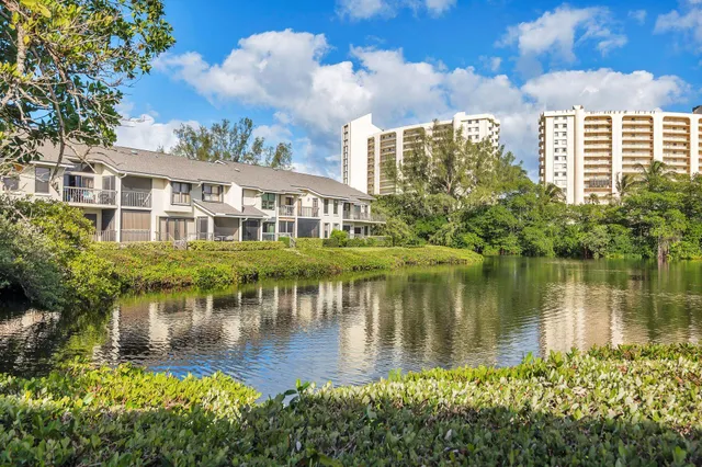 a front view of a house with garden and porch
