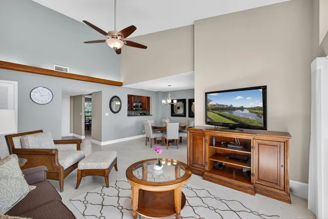 a dining room with furniture and a window