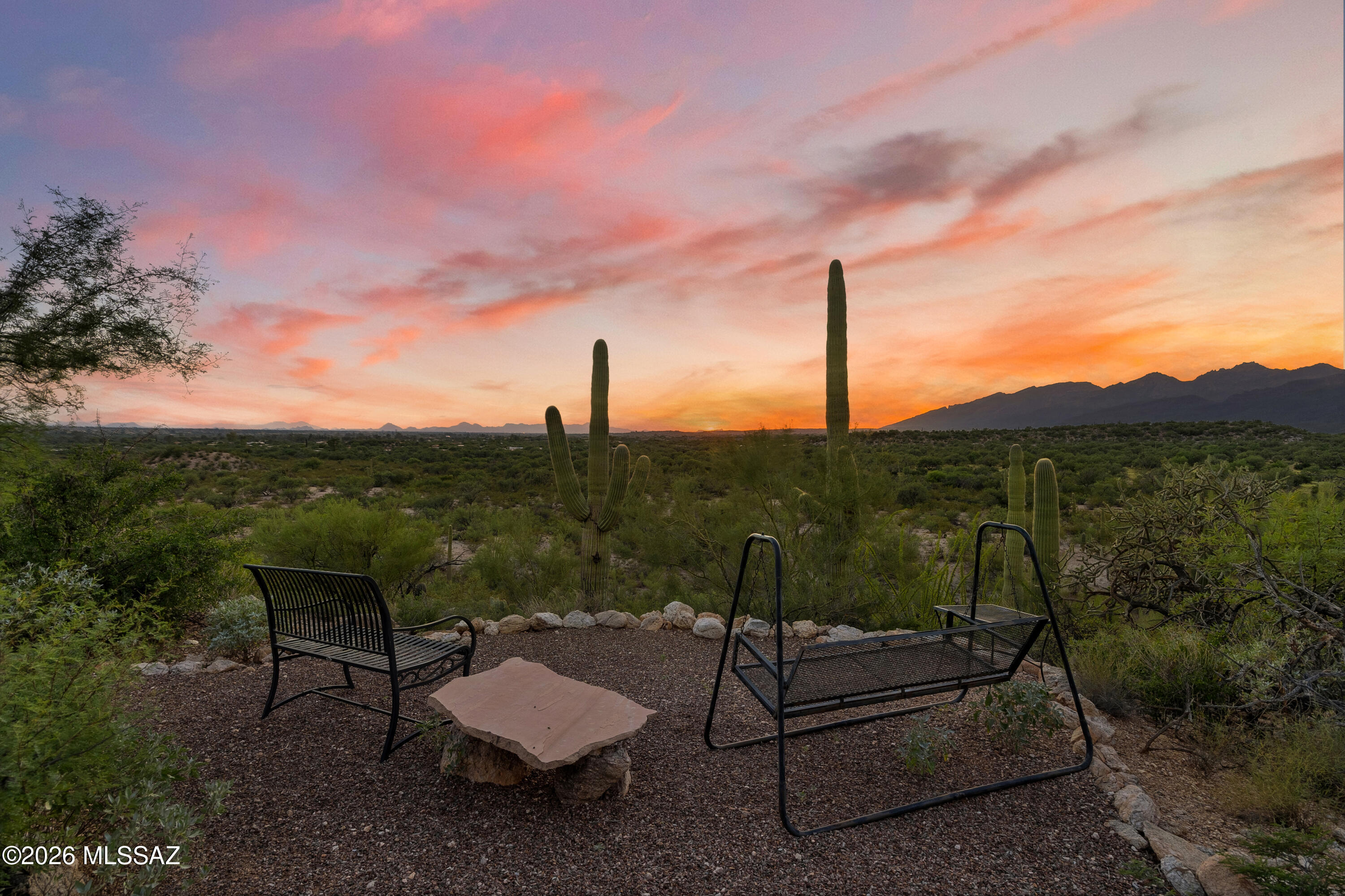 13013 East Redington Road Tucson, AZ 85749 - Photo 3 of 51 A short walk on a private trail from the residence leads to a hillside promontory overlooking Alhambra wash and the vast untouched desert land that surrounds the property. Incredible spot to catch Tucson's iconic sunsets.