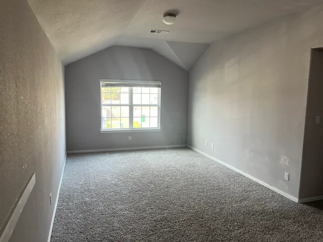 an empty room that has a window