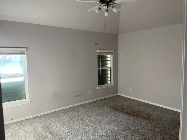 an empty room with a empty space and window