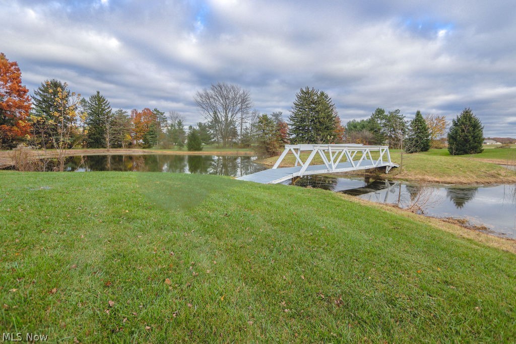 51883 Telegraph Road Amherst, OH 44001 - Photo 32 of 49 View of dock with a lawn and a water view