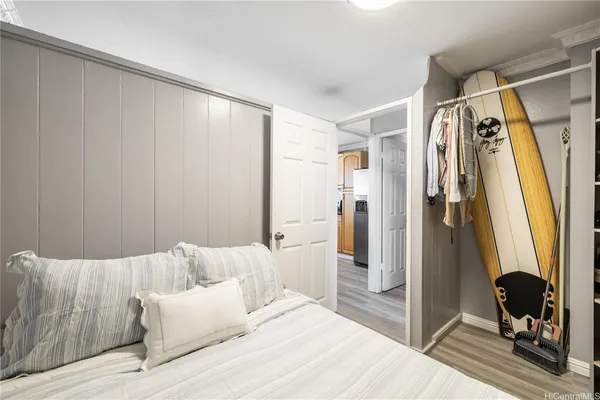 a bedroom with a bed and a mirror