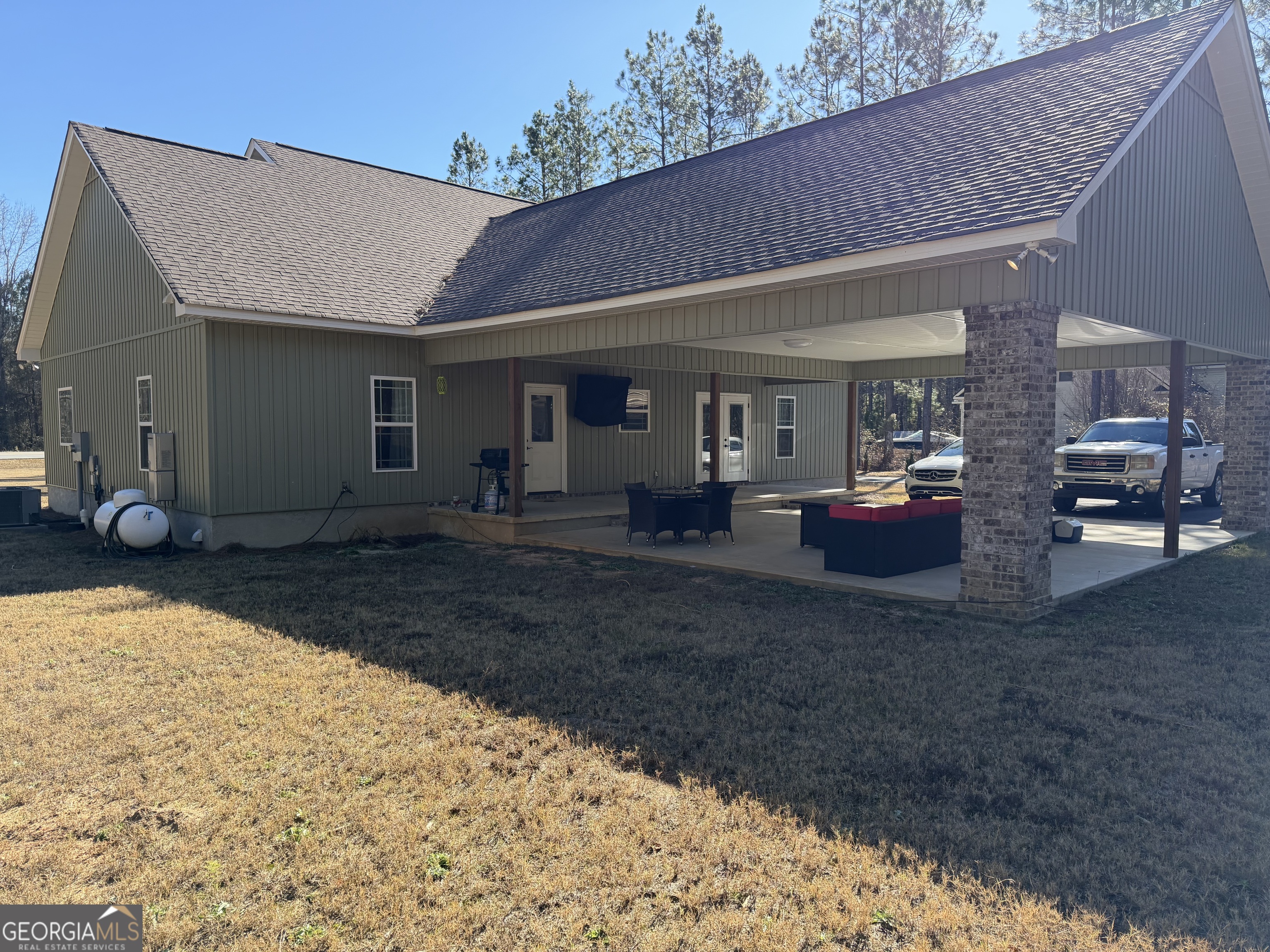 1347 Payne Road Rentz, GA 31075 - Photo 12 of 45 a view of a house with backyard and sitting area