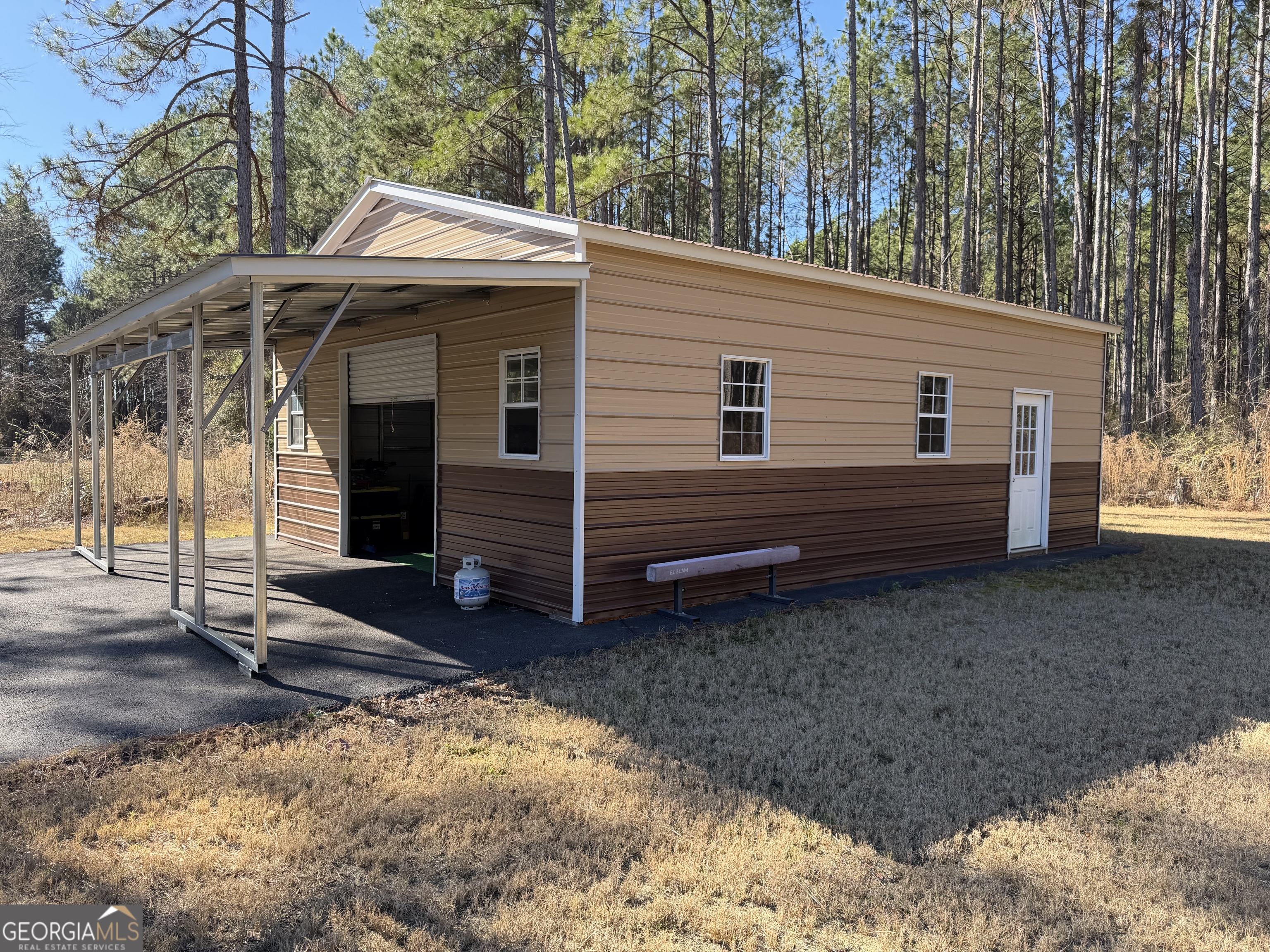 1347 Payne Road Rentz, GA 31075 - Photo 13 of 45 a front view of a house with a yard
