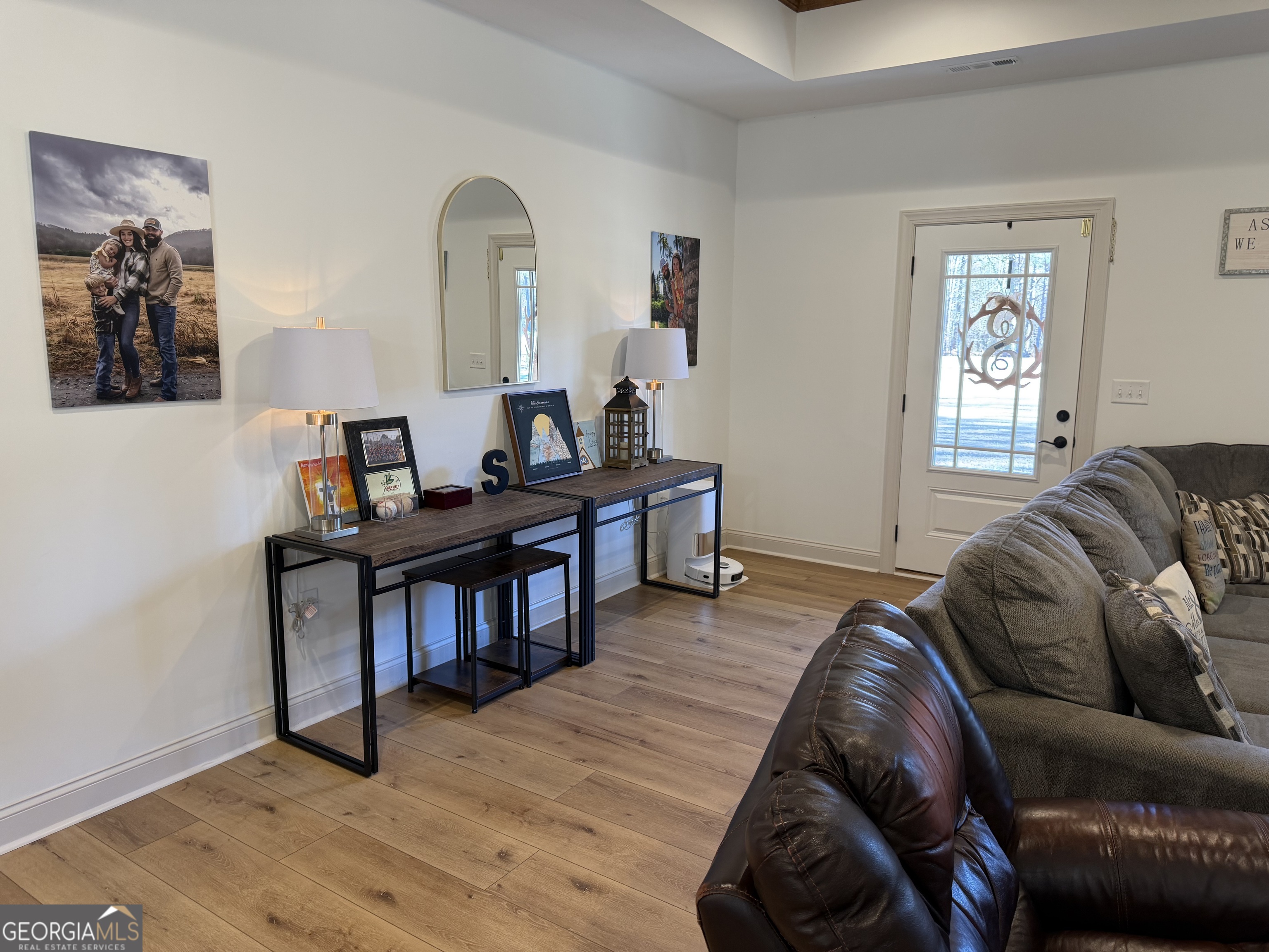 1347 Payne Road Rentz, GA 31075 - Photo 24 of 45 a living room with furniture and a wooden floor