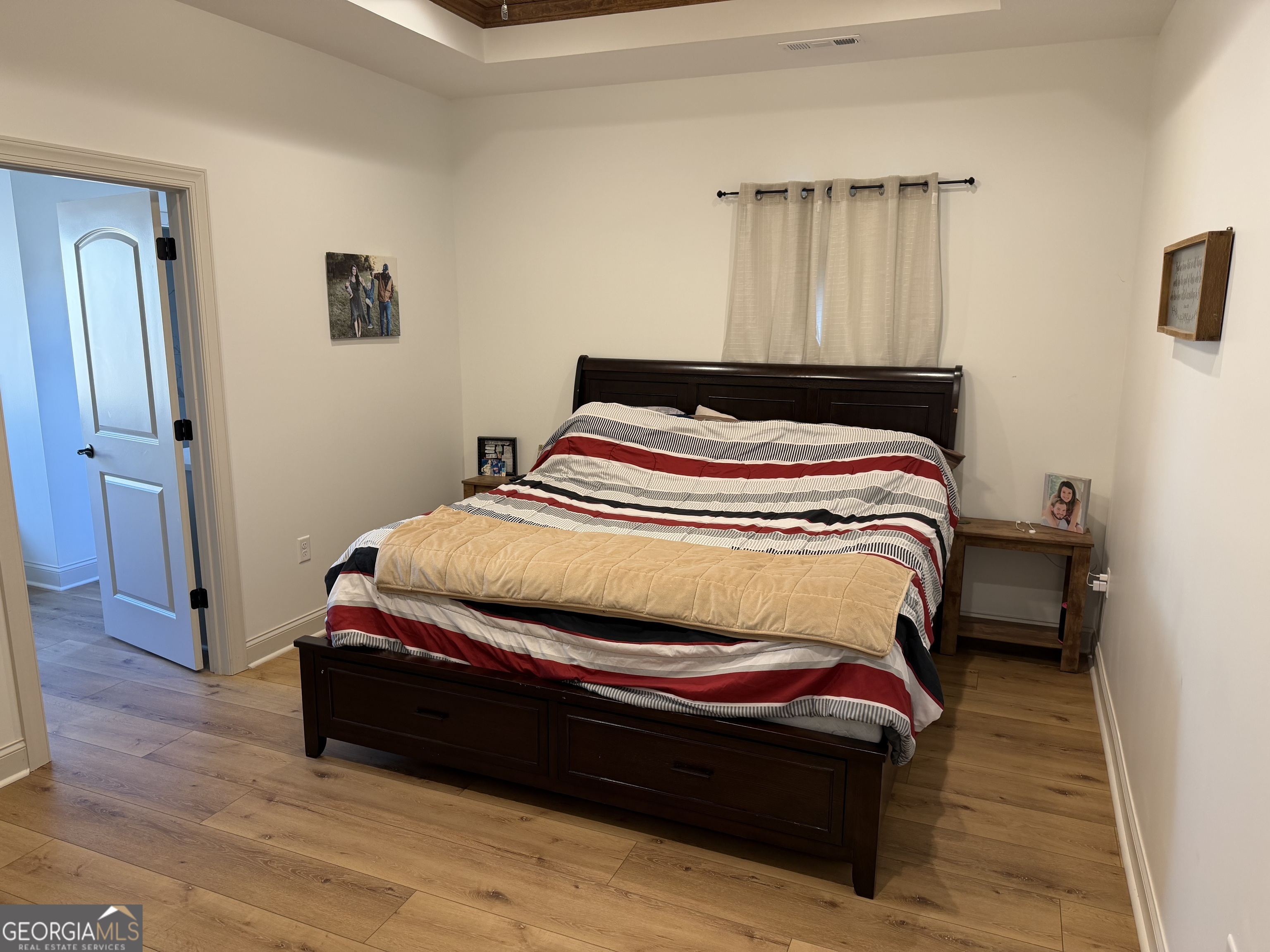 1347 Payne Road Rentz, GA 31075 - Photo 25 of 45 a bedroom with a bed and wooden floor