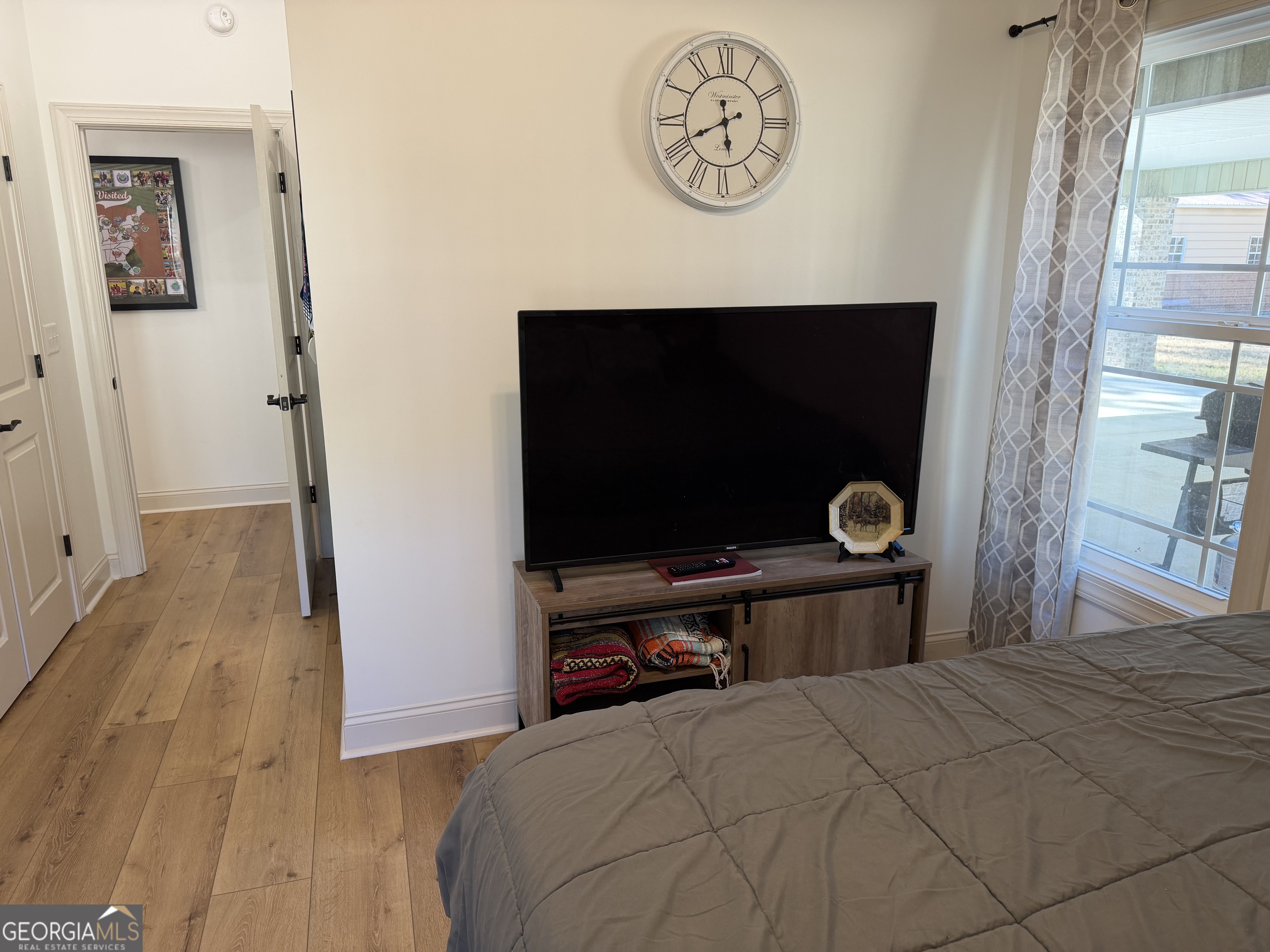 1347 Payne Road Rentz, GA 31075 - Photo 36 of 45 a bedroom with a bed and a flat screen tv