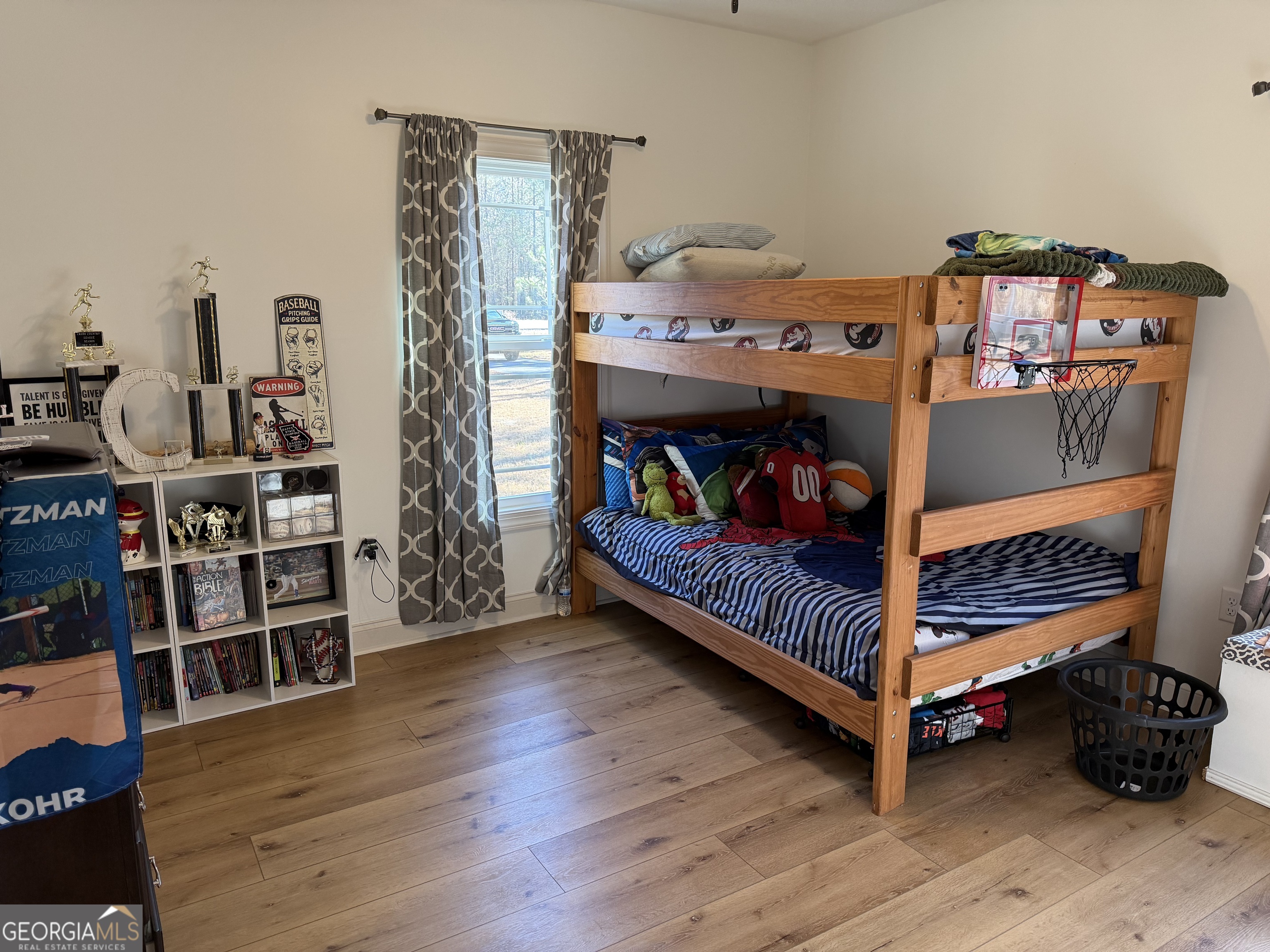 1347 Payne Road Rentz, GA 31075 - Photo 37 of 45 a bedroom with furniture and wooden floor