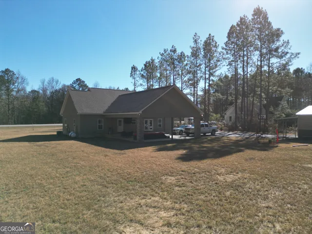 a view of patio with a yard
