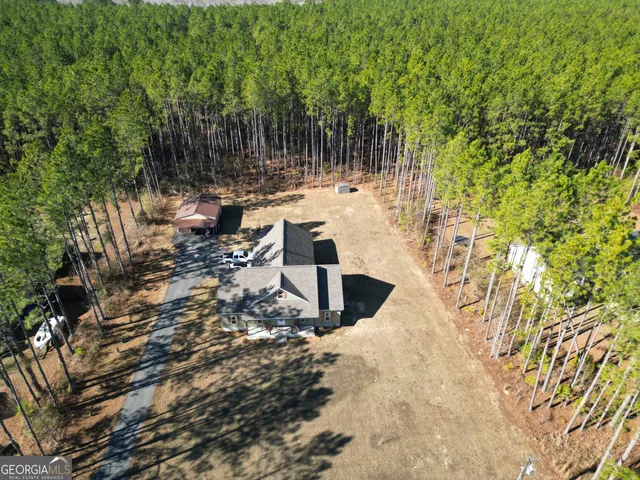 a view of a patio with table and chairs and wooden floor