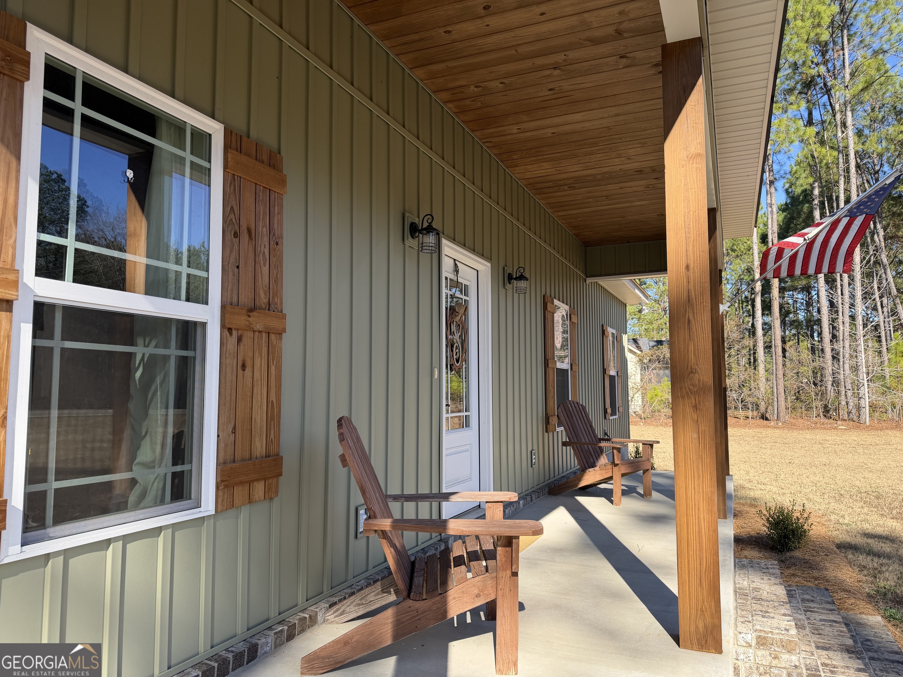 1347 Payne Road Rentz, GA 31075 - Photo 9 of 45 a view of a patio with table and chairs and wooden floor
