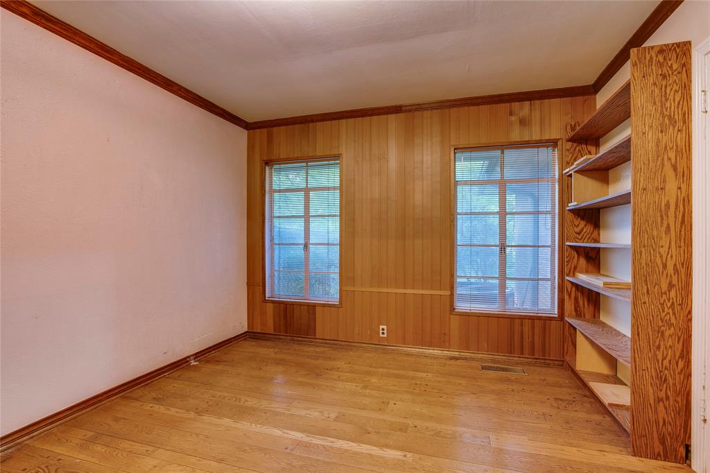 1439 Jr Drive Dallas, TX 75208 - Photo 21 of 39 a view of an empty room with a window and wooden floor