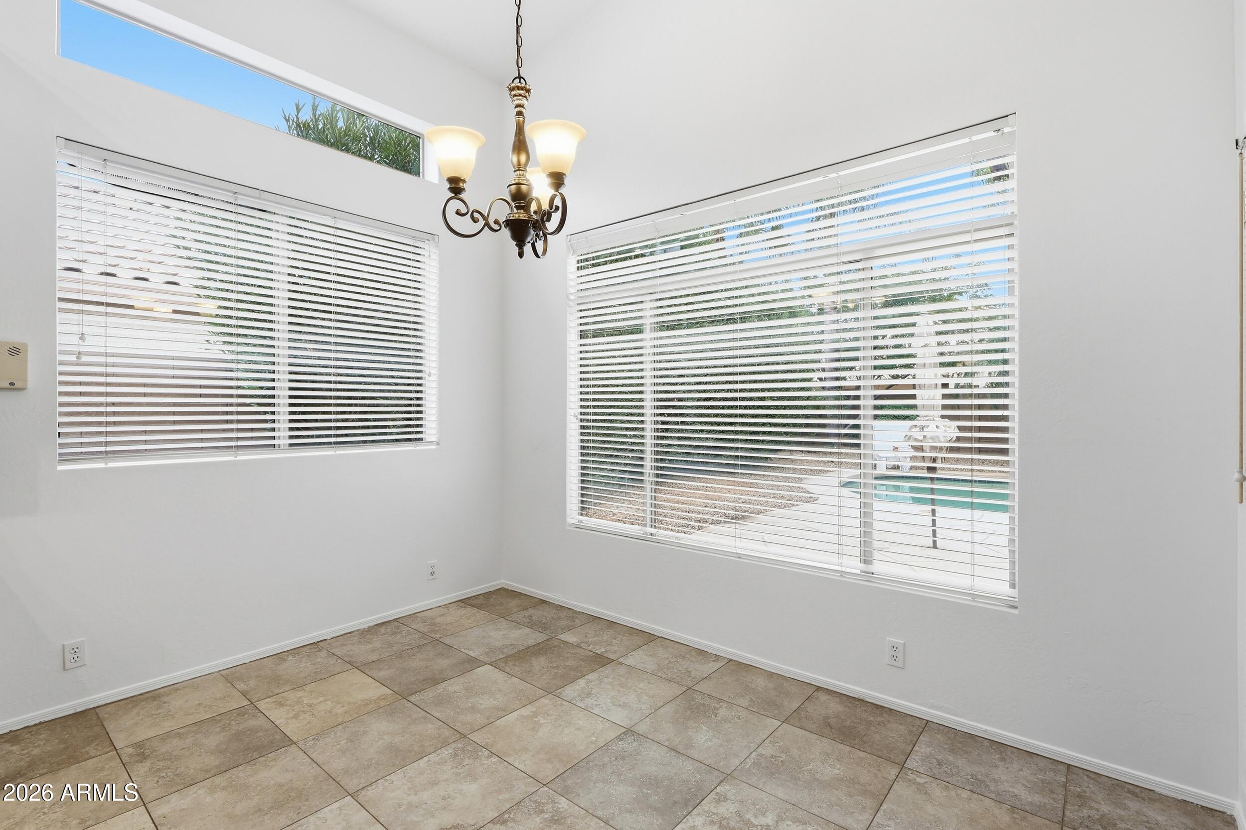 5377 West Jupiter Way Chandler, AZ 85226 - Photo 14 of 49 a view of an empty room with a window