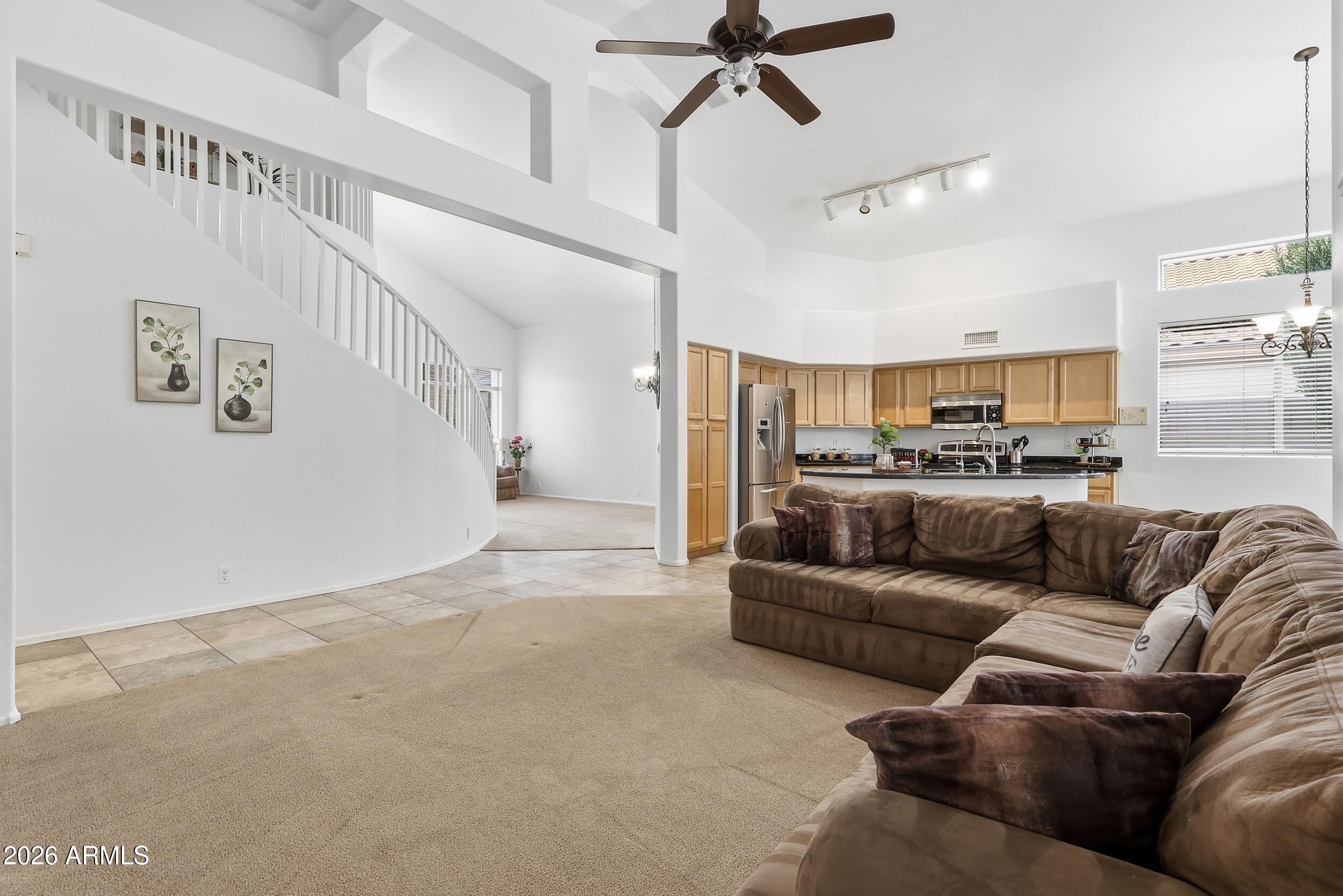 5377 West Jupiter Way Chandler, AZ 85226 - Photo 16 of 49 a living room with furniture and a ceiling fan