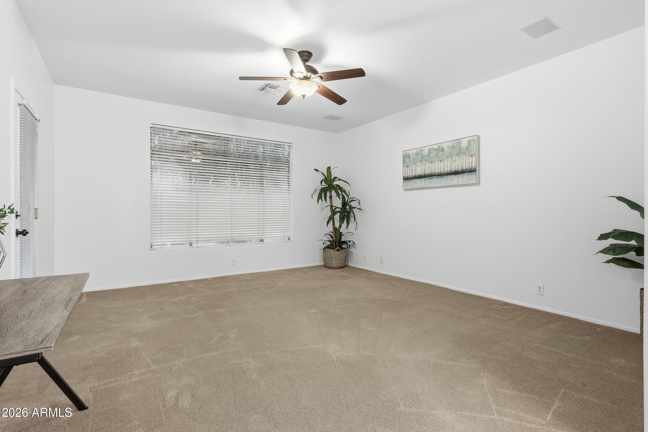 5377 West Jupiter Way Chandler, AZ 85226 - Photo 19 of 49 a view of a room with a ceiling fan