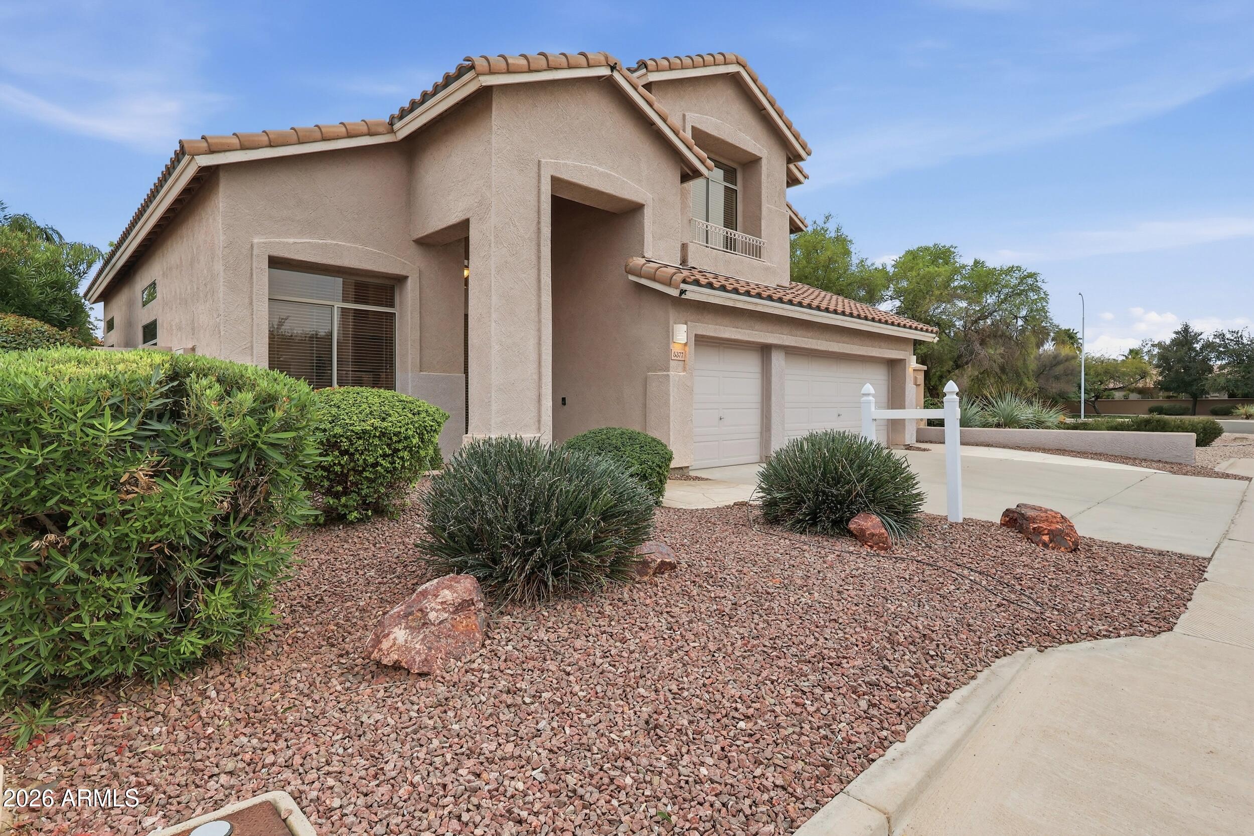 5377 West Jupiter Way Chandler, AZ 85226 - Photo 2 of 49 a front view of a house with garden