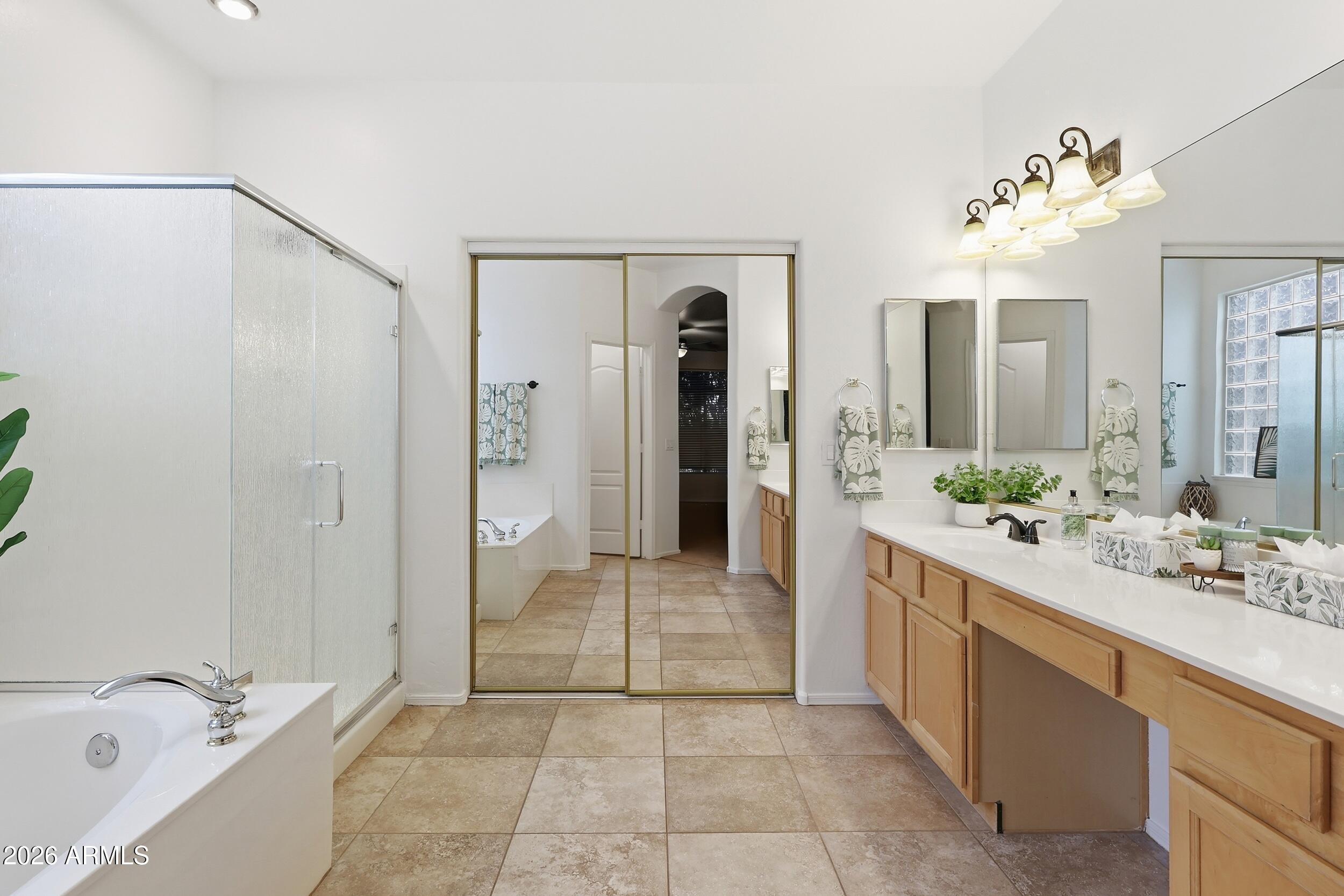 5377 West Jupiter Way Chandler, AZ 85226 - Photo 23 of 49 a bathroom with a double vanity sink mirror and shower