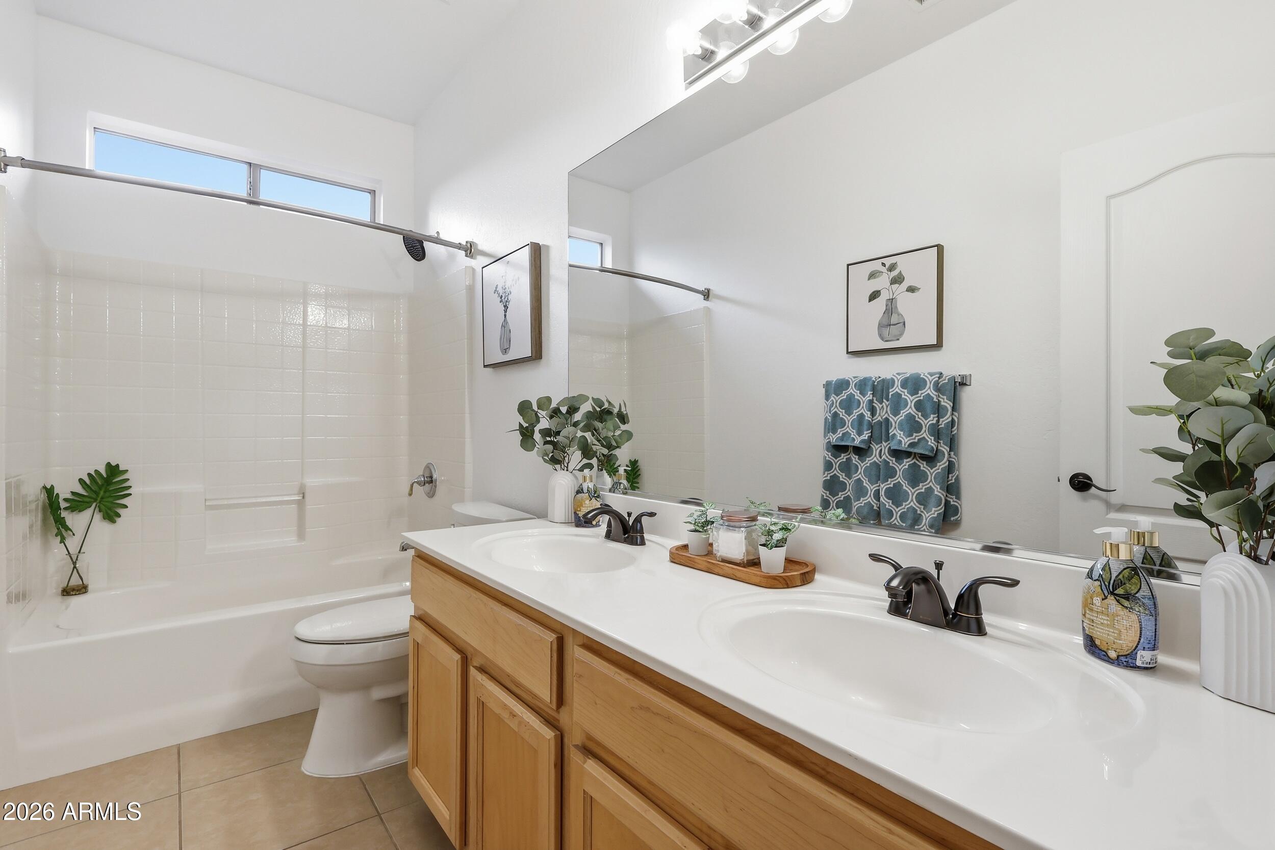 5377 West Jupiter Way Chandler, AZ 85226 - Photo 28 of 49 a bathroom with a sink a toilet and shower