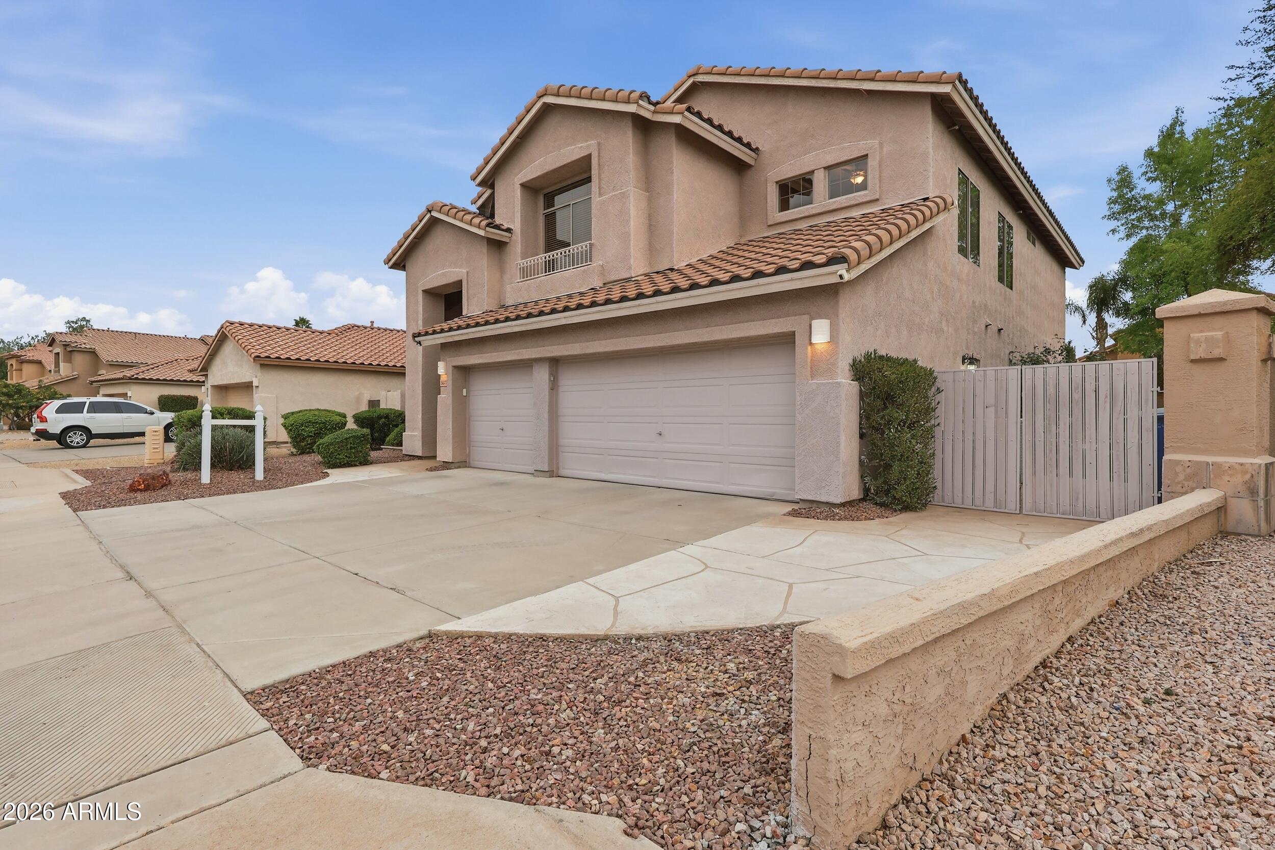 5377 West Jupiter Way Chandler, AZ 85226 - Photo 3 of 49 a front view of a house with a garage