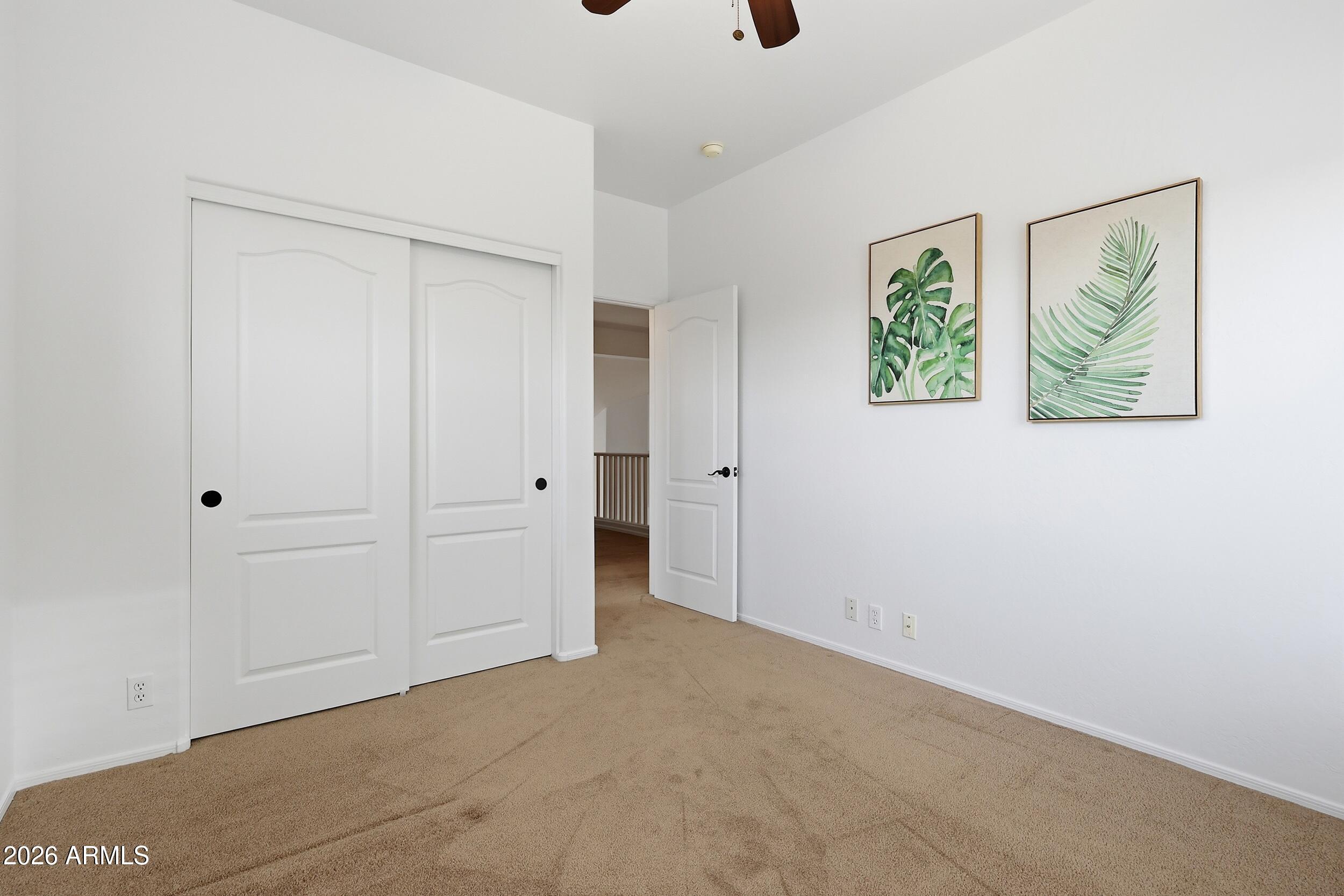 5377 West Jupiter Way Chandler, AZ 85226 - Photo 32 of 49 a view of an empty room with a painting on the wall