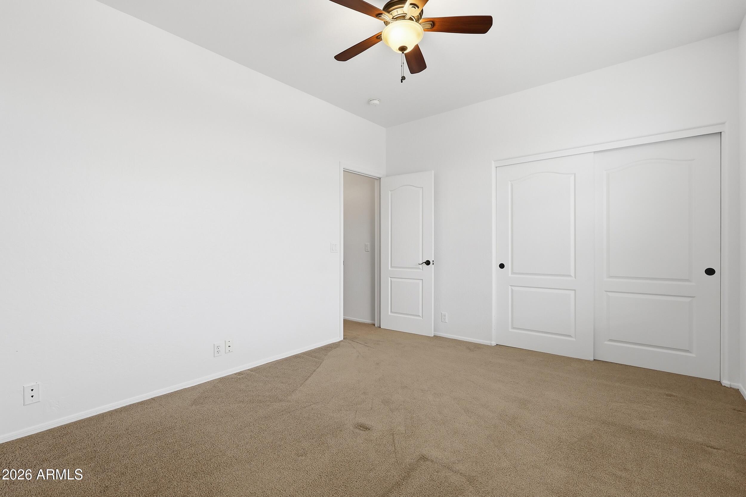 5377 West Jupiter Way Chandler, AZ 85226 - Photo 34 of 49 an empty room with a ceiling fan
