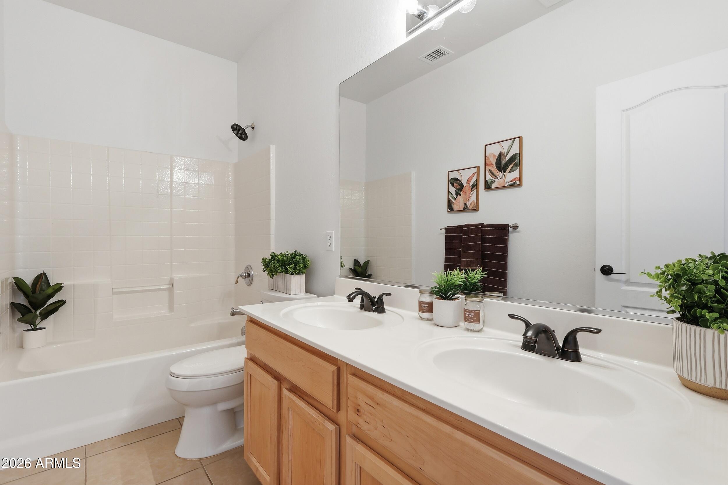 5377 West Jupiter Way Chandler, AZ 85226 - Photo 35 of 49 a bathroom with a sink a toilet and tub
