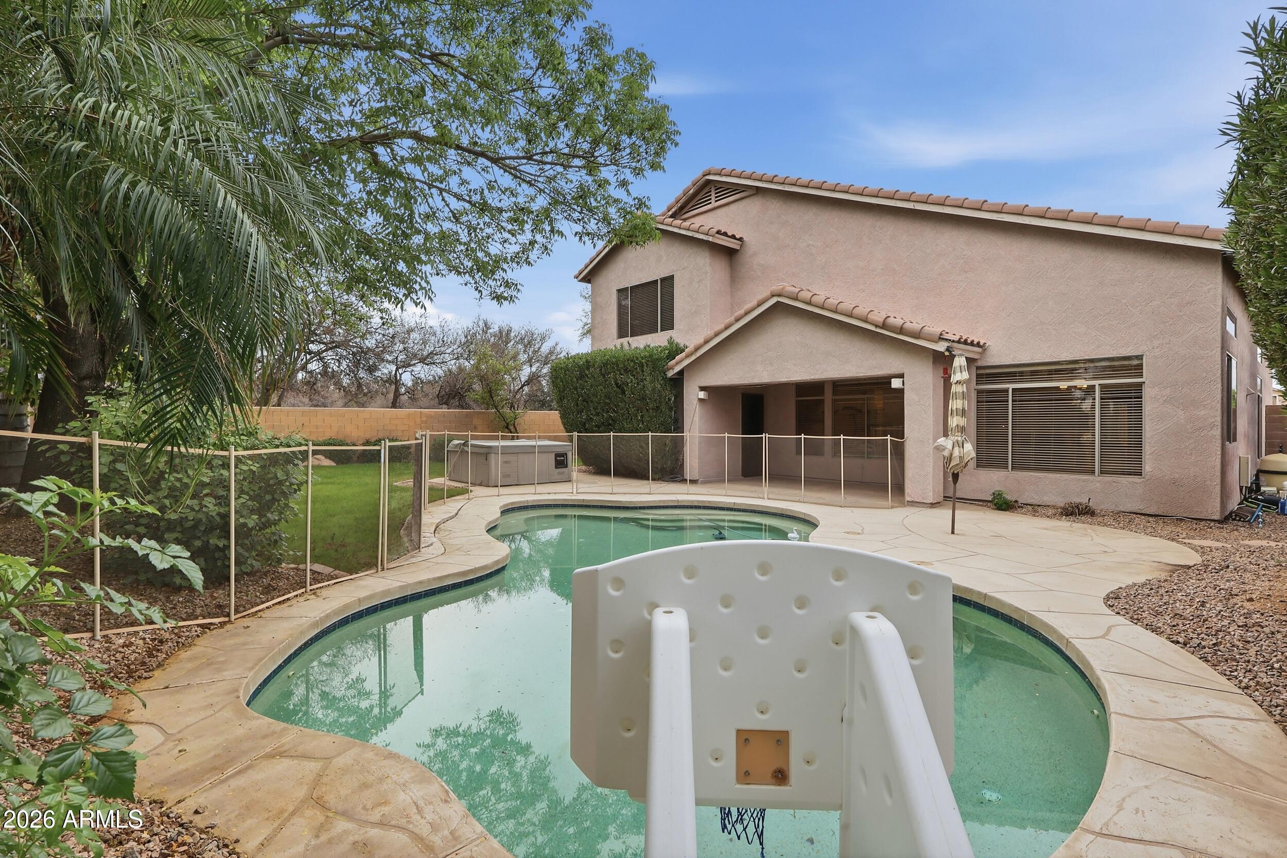 5377 West Jupiter Way Chandler, AZ 85226 - Photo 41 of 49 a front view of a house with garden