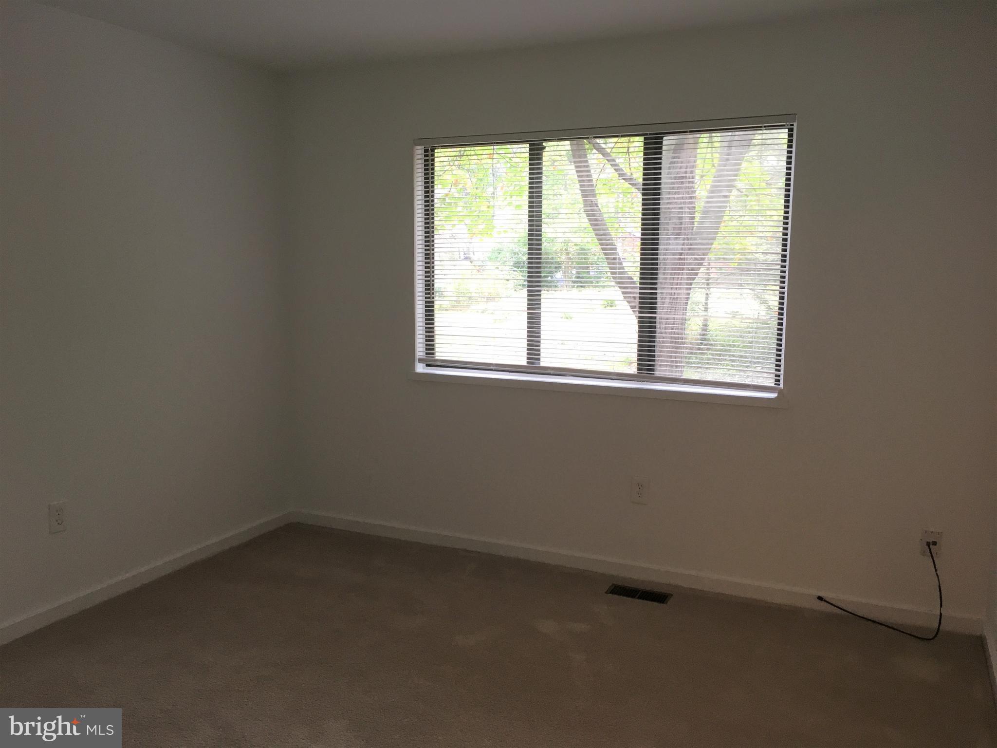 10343 Tailcoat Way Columbia, MD 21044 - Photo 16 of 21 an empty room with a window
