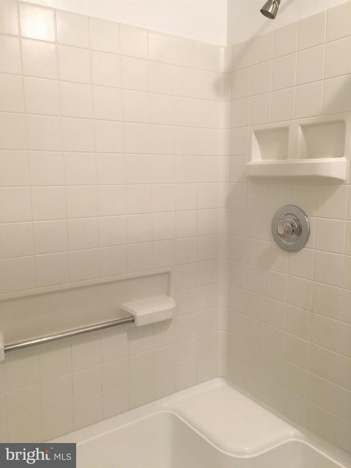 10343 Tailcoat Way Columbia, MD 21044 - Photo 18 of 21 a bathroom with a shower a toilet and sink