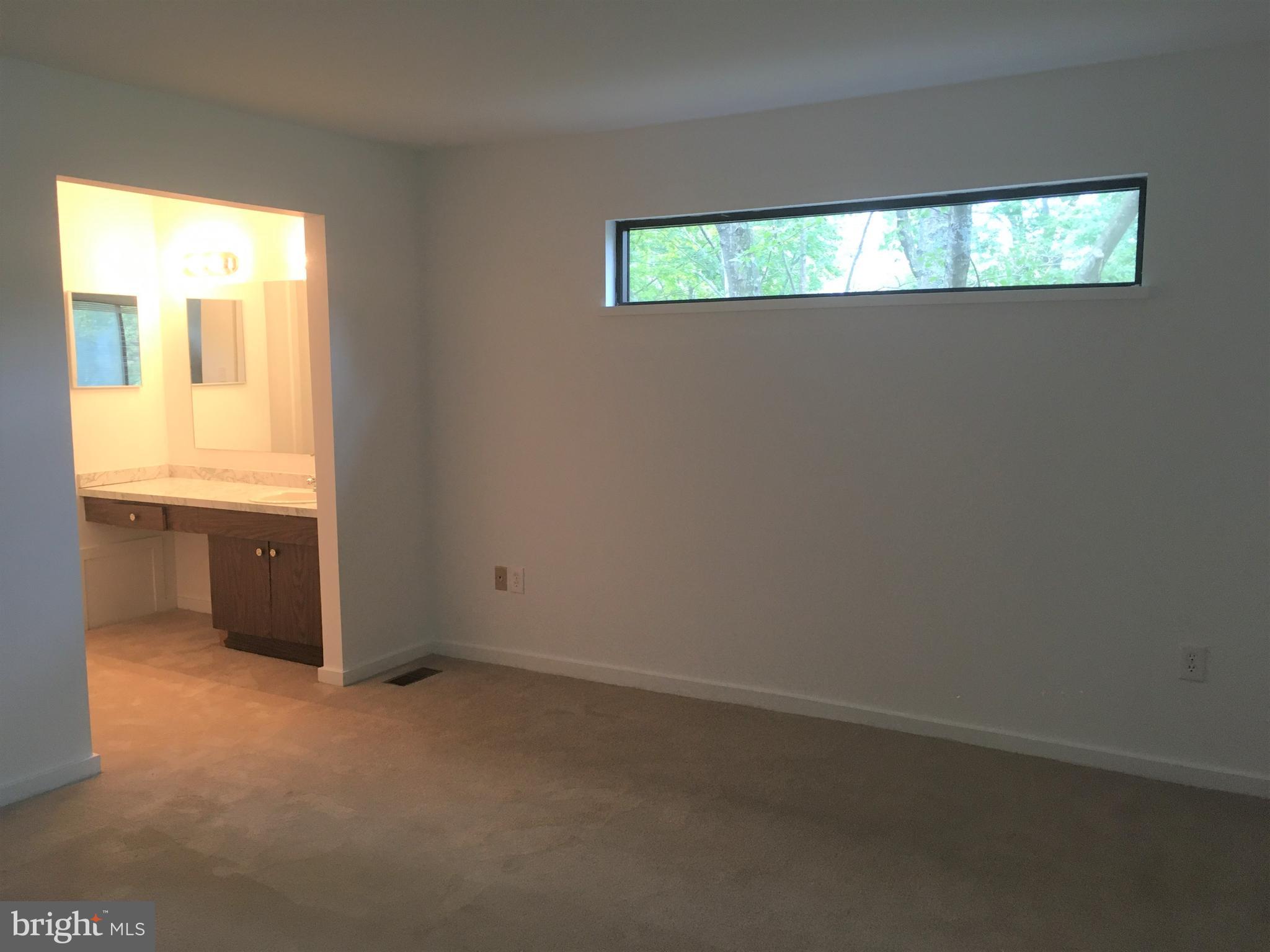 10343 Tailcoat Way Columbia, MD 21044 - Photo 19 of 21 an empty room with a window