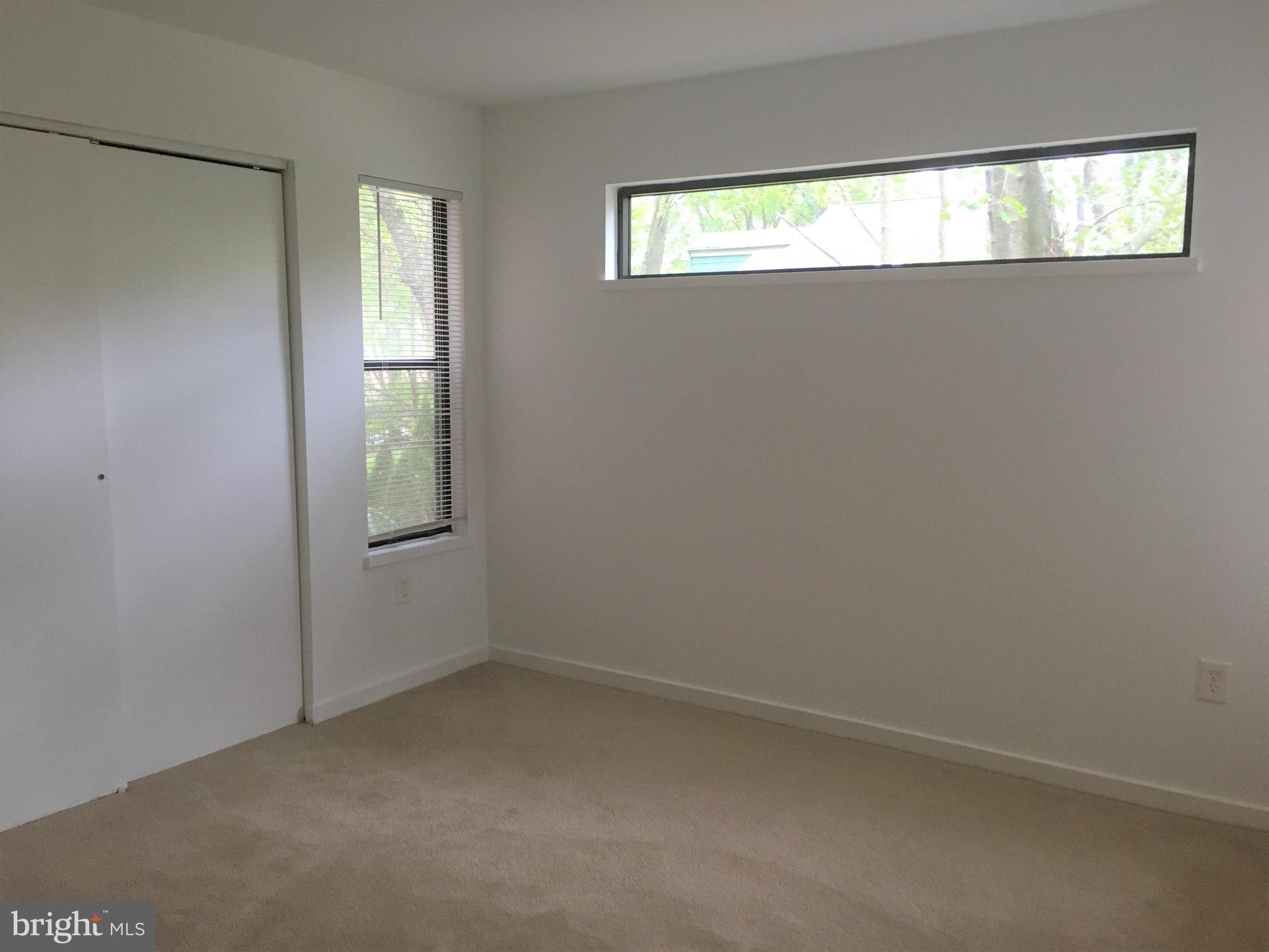 10343 Tailcoat Way Columbia, MD 21044 - Photo 20 of 21 an empty room with windows