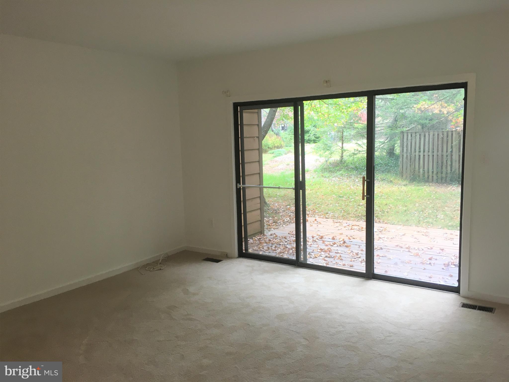 10343 Tailcoat Way Columbia, MD 21044 - Photo 5 of 21 a view of an empty room with a large window