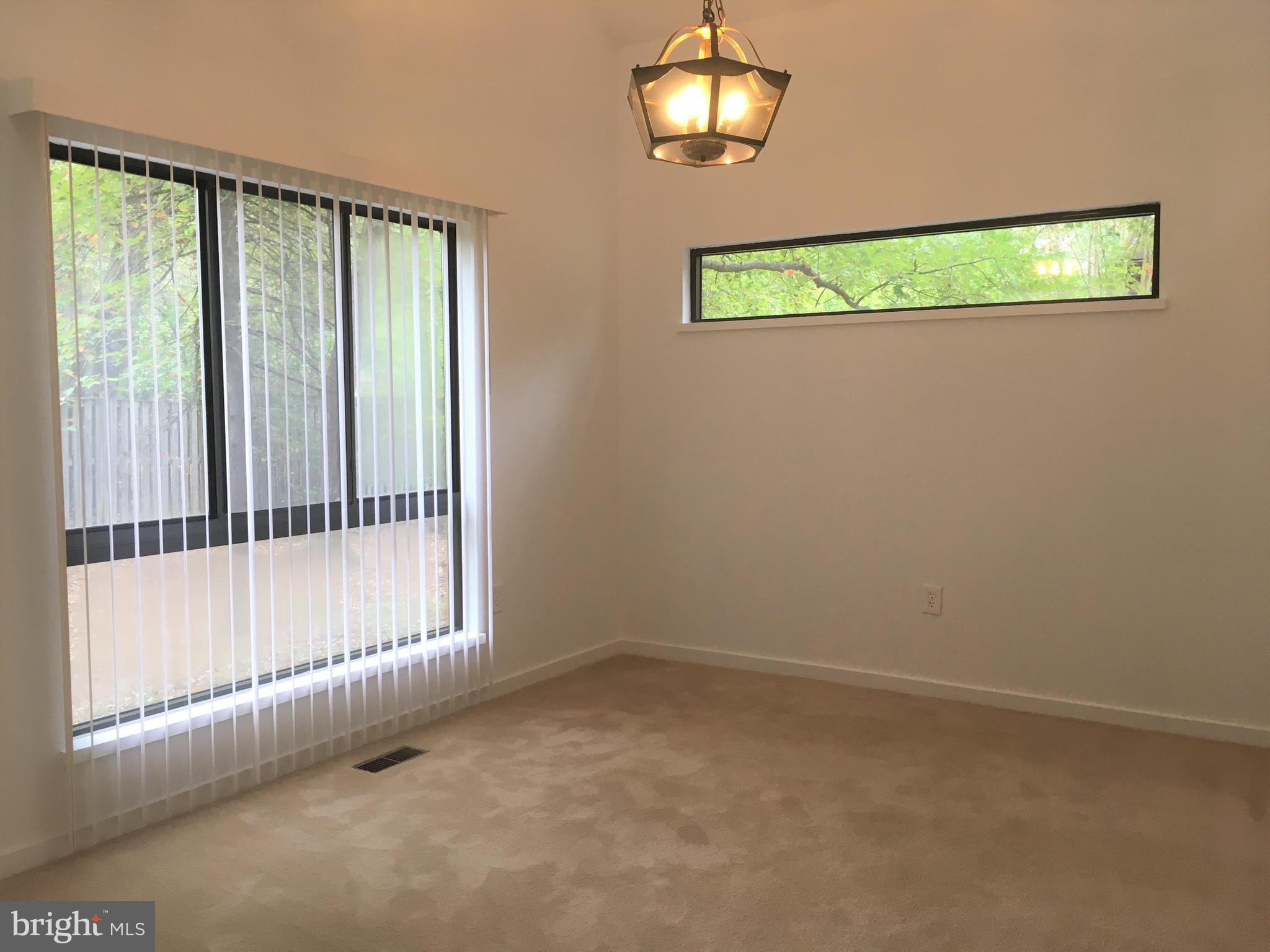 10343 Tailcoat Way Columbia, MD 21044 - Photo 10 of 21 an empty room with windows