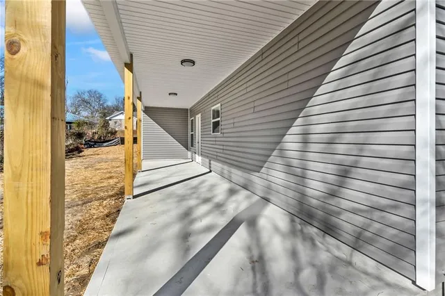 a view of a house with a snow on the road
