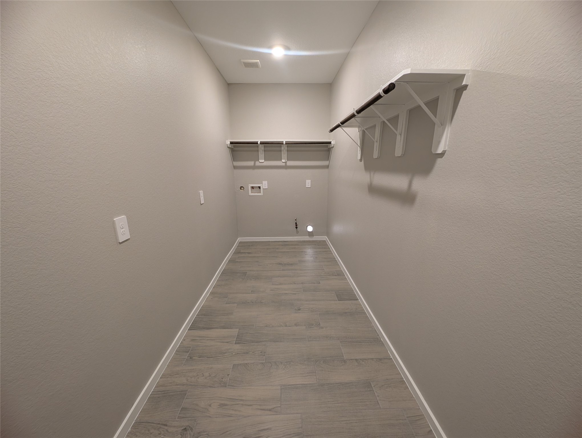 7745 Swiftwater Lane, Unit A Houston, TX 77075 - Photo 20 of 33 a view of a hallway with wooden floor and a bathroom