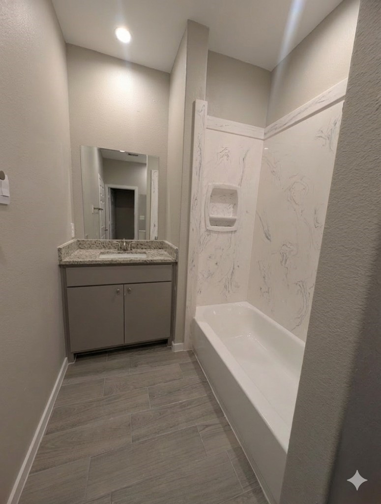7745 Swiftwater Lane, Unit A Houston, TX 77075 - Photo 24 of 33 a bathroom with a tub a sink and a mirror