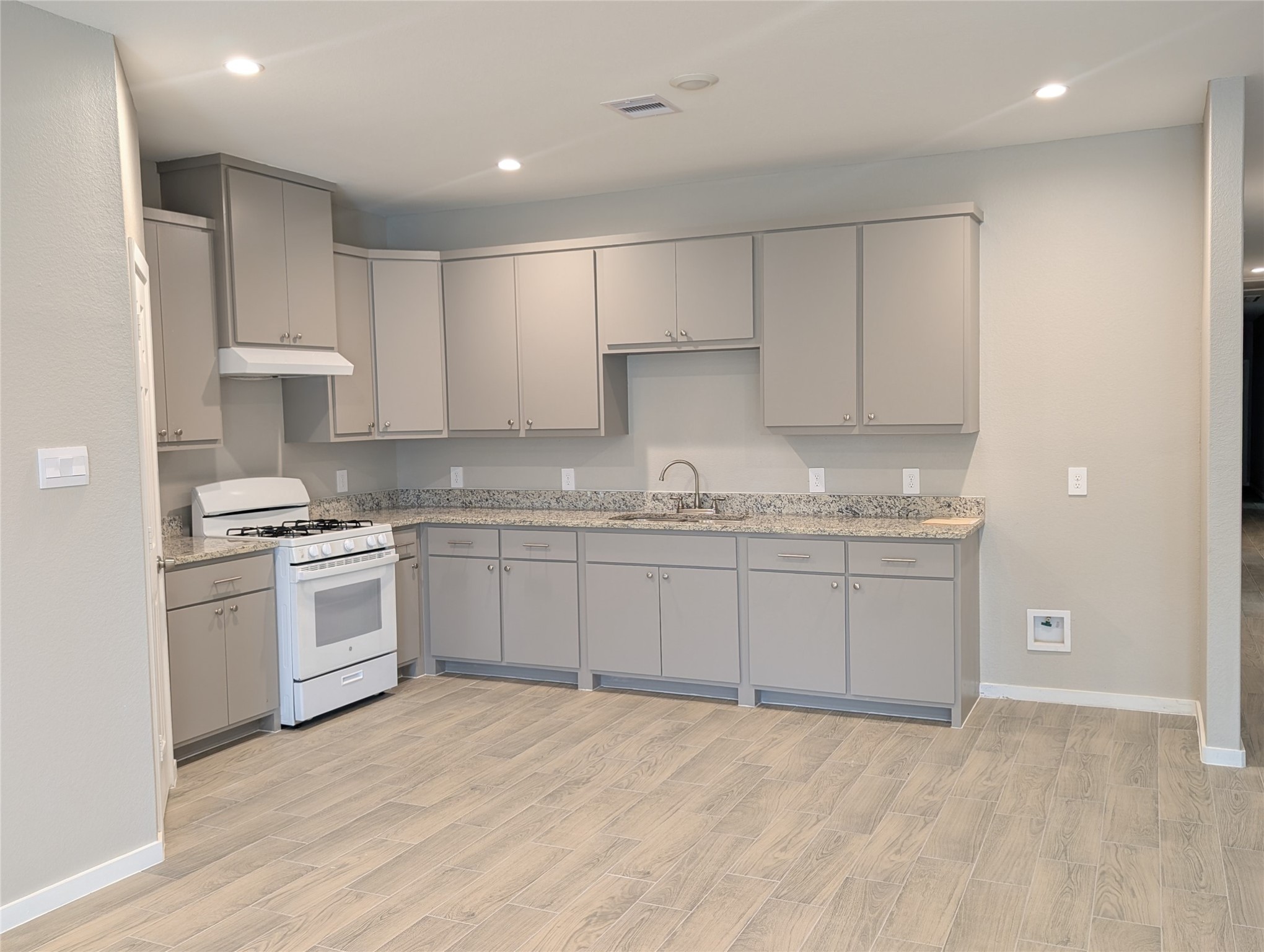 7745 Swiftwater Lane, Unit A Houston, TX 77075 - Photo 9 of 33 a kitchen with granite countertop a sink stainless steel appliances and cabinets