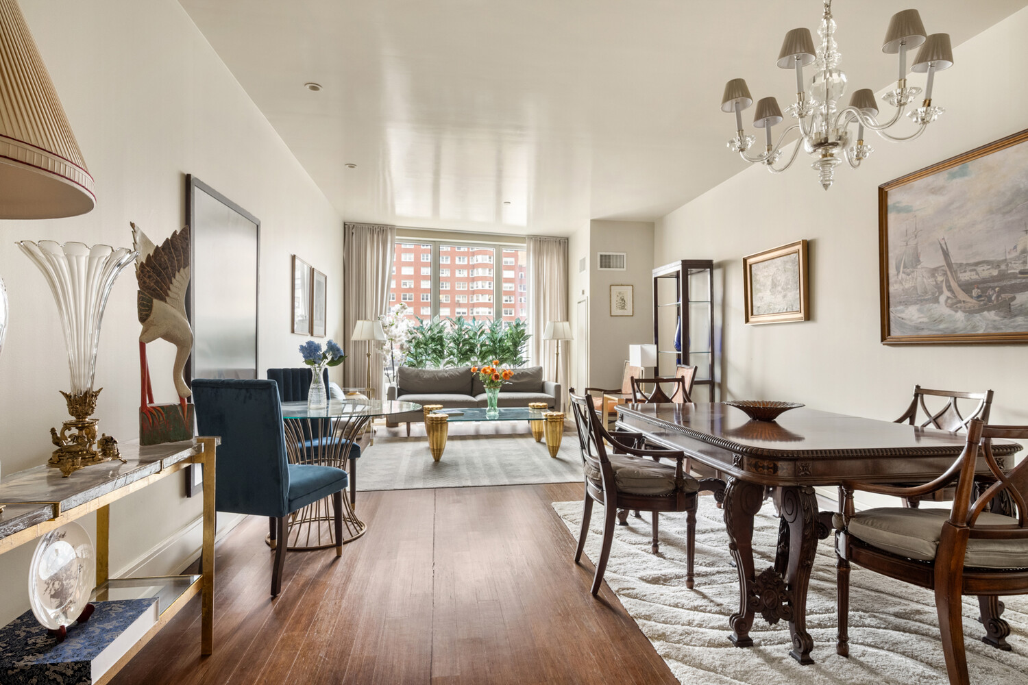255 East 74th Street, Unit 6B Manhattan, NY 10021 - Photo 3 of 10 a view of a dining room with furniture window and wooden floor