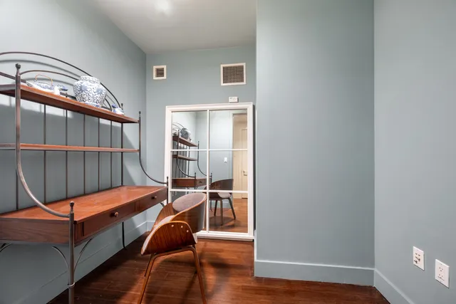 a bedroom with a large bed and a couch