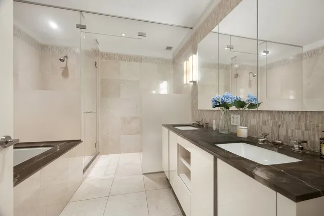 a bedroom with furniture and wooden floor