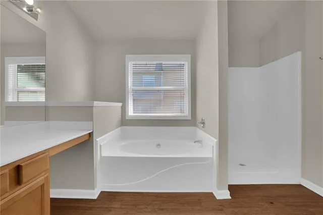 a white bath tub sitting next to a window