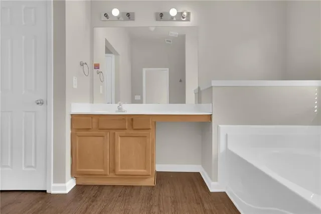 a bathroom with a bathtub and a sink