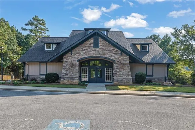 an outdoor space with pool and furniture