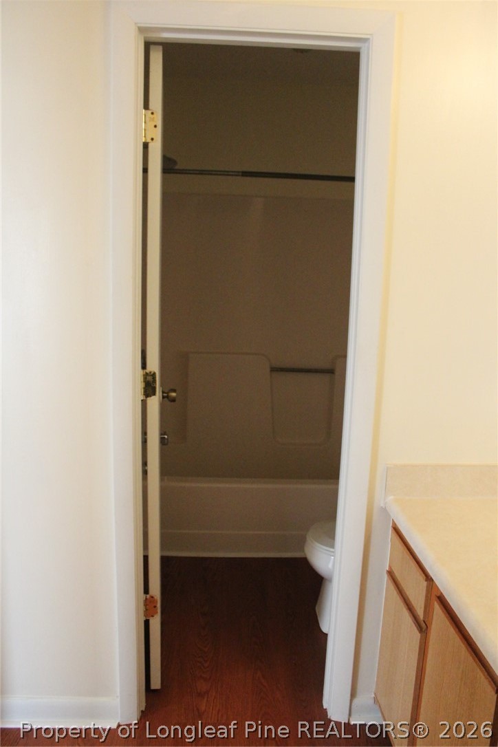7805 Gallant Ridge Drive Fayetteville, NC 28314 - Photo 14 of 25 a bathroom with a glass shower door