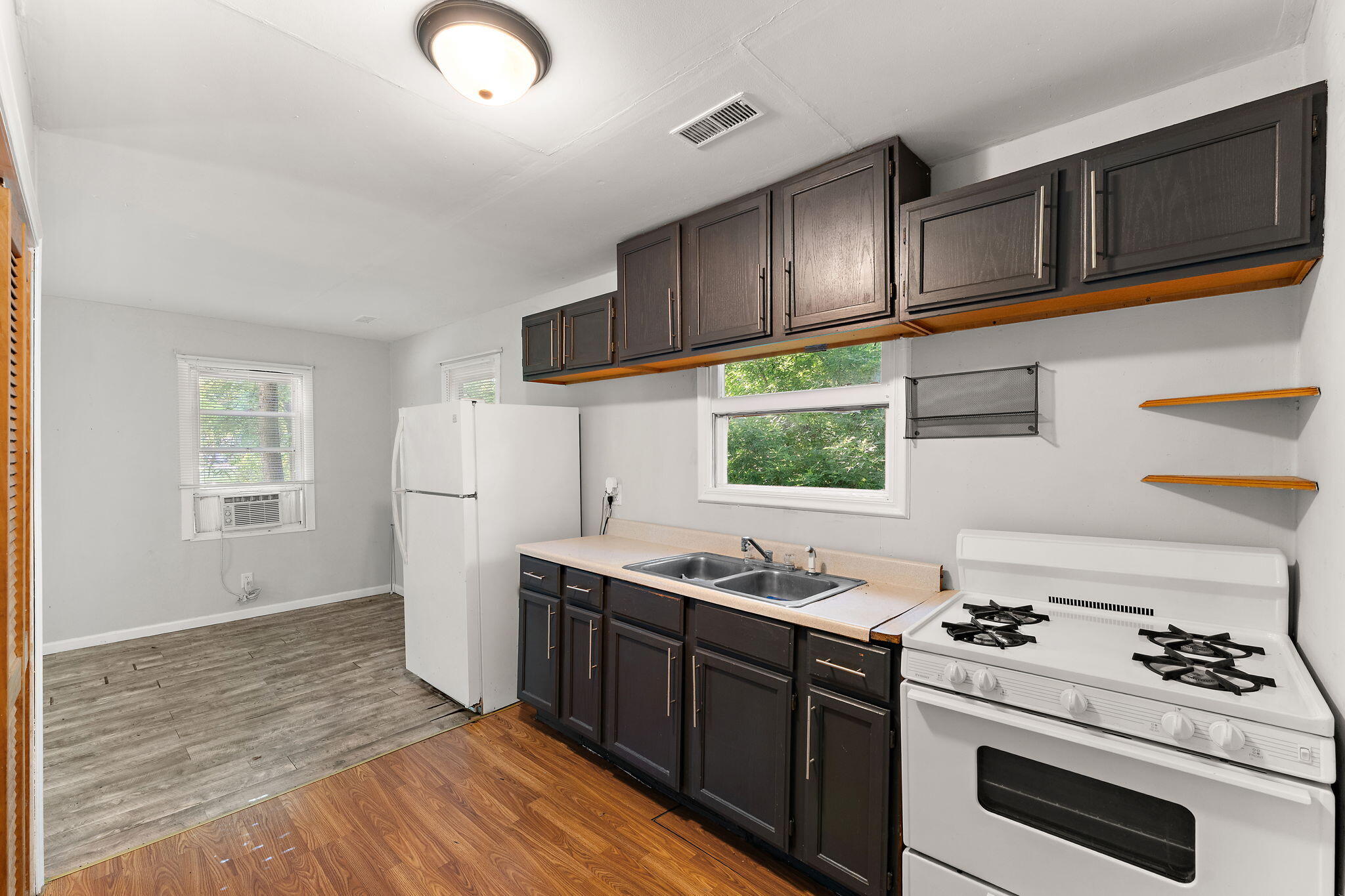 1910 South Calhoun Street Griffith, IN 46319 - Photo 5 of 34 a kitchen with stainless steel appliances granite countertop a stove and a sink