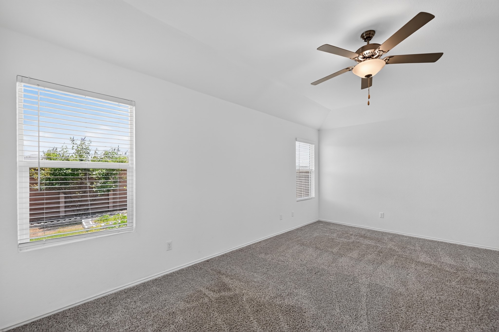 128 Konik Road Georgetown, TX 78626 - Photo 13 of 34 A quiet retreat with a soaring ceiling and soft carpet, bathed in natural light.