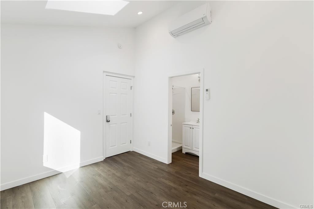 552 North Cambridge Street Orange, CA 92867 - Photo 17 of 18 a view of an empty room with wooden floor and closet