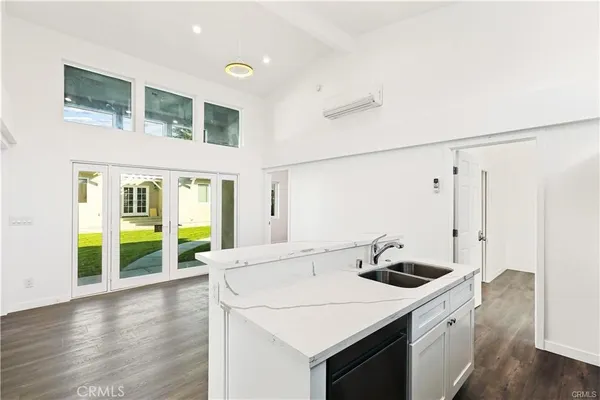a kitchen with a sink and a large window